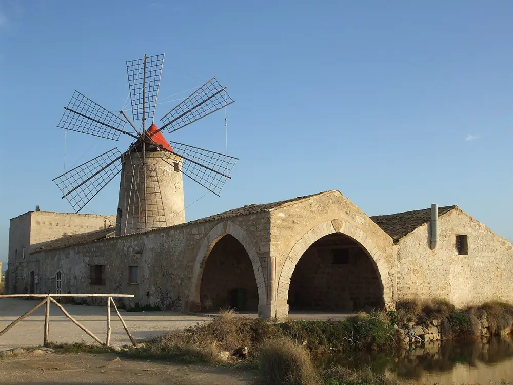 The windmill and arched salt store of the Museo del Sale at Nubia, in the salt pans south of Trapani